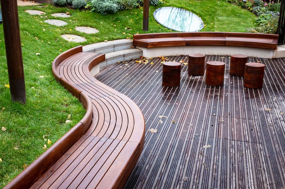 Bespoke curved timber seating for courtyard garden IOTA ESI