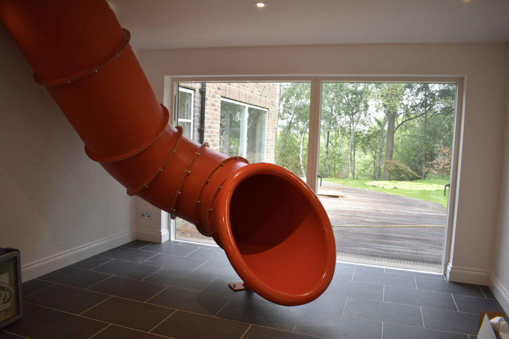 Bespoke indoor tube slide installed in family home eibe Play Ltd