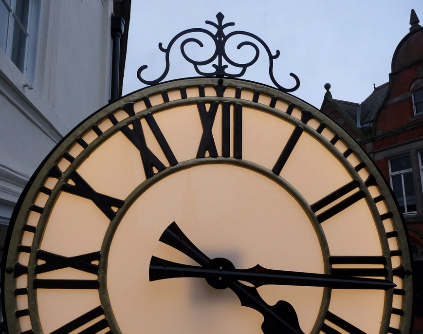 Replica ornate drum clock for company building exterior Replica ornate drum clock for company building exterior