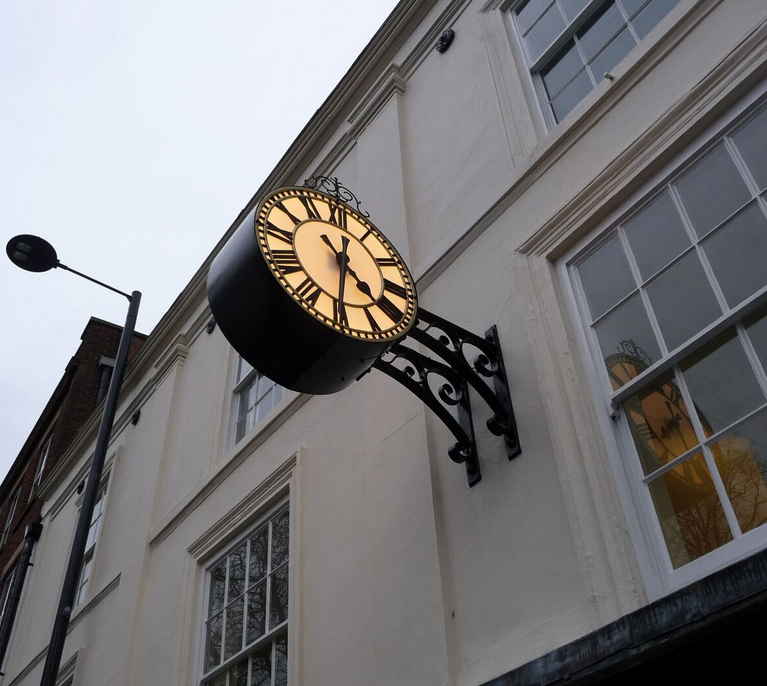 Replica ornate drum clock for company building exterior