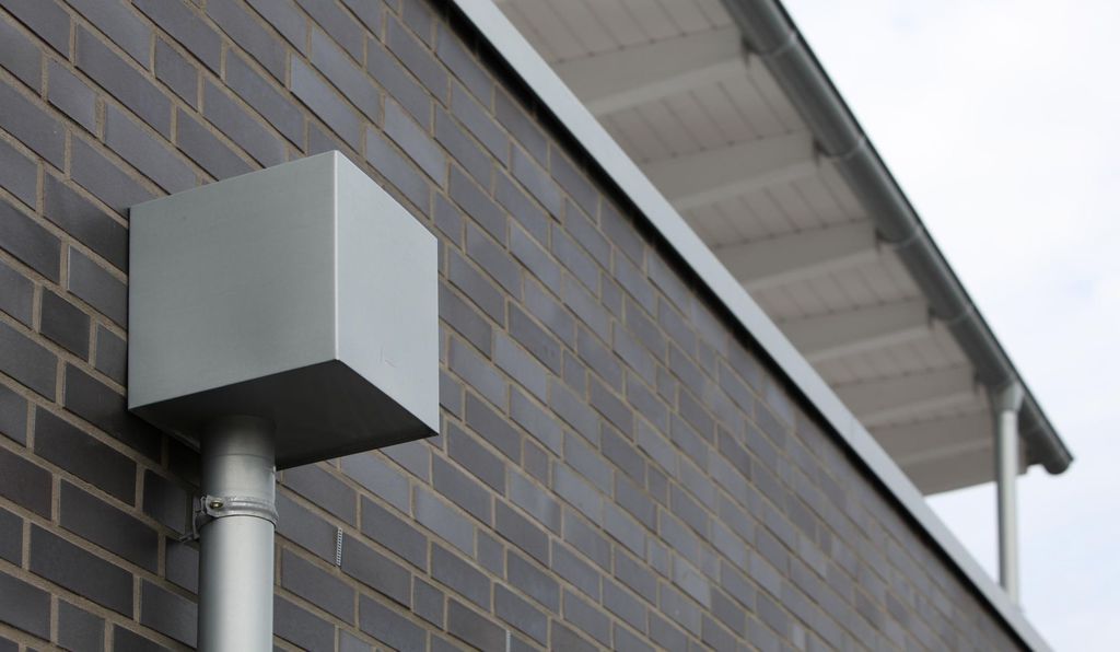 Zinc roof drainage system with gutters and downpipes RHEINZINK ESI