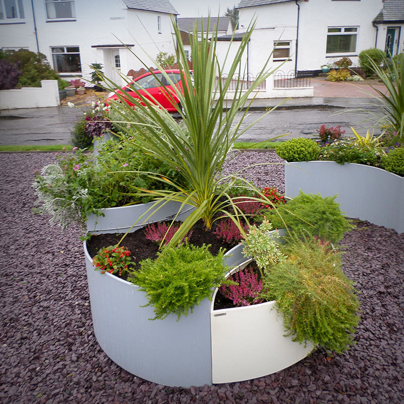 Black and white planters brighten central community area Artform