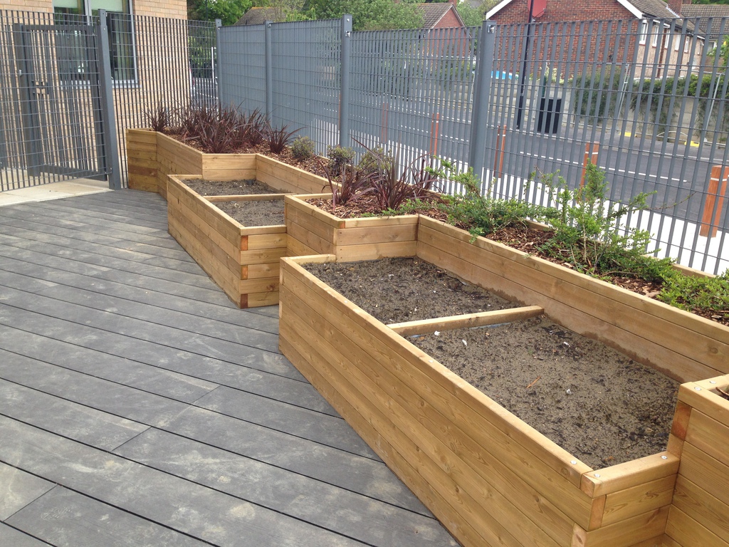 Bespoke wooden fruit and veg planters for SEN school Taylor Made
