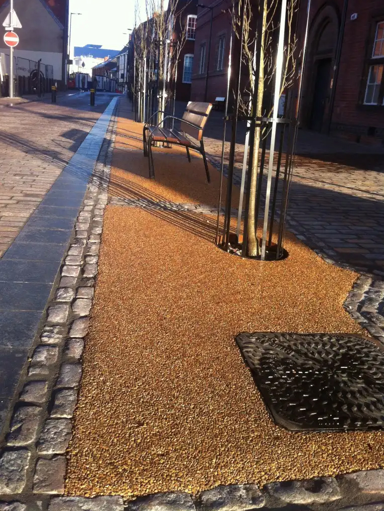 Resin bound, water permeable gravel tree pit surfacing HMS Decorative