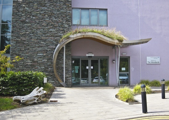 Curved green roof entrance canopy