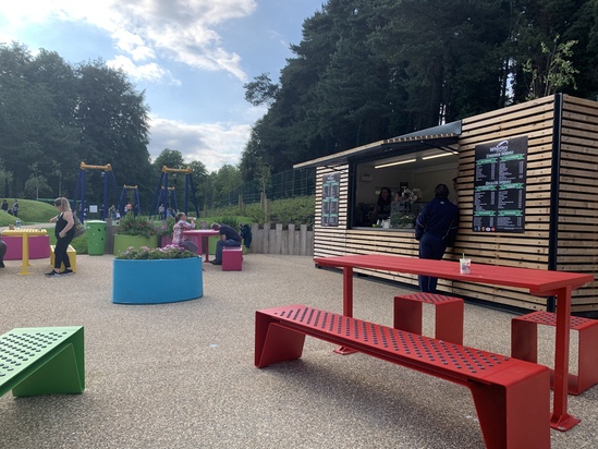 Brightly coloured picnic suites and planters for park