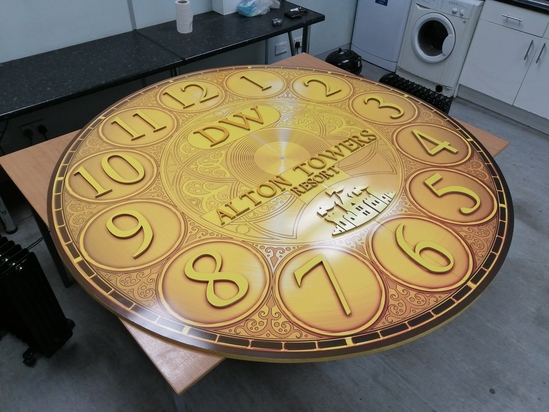 Bespoke theme park clock with raised Roman numerals