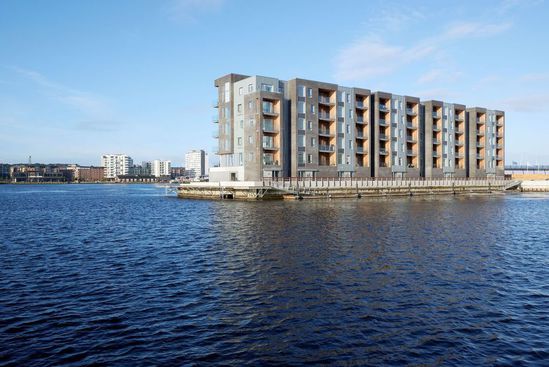 Double standing seam cladding for waterfront apartments | RHEINZINK ...