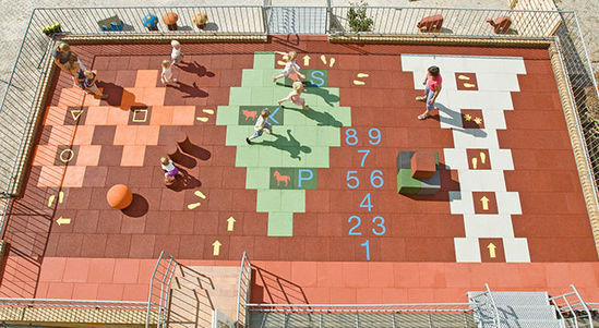 Playground impact protection tiles with design motifs
