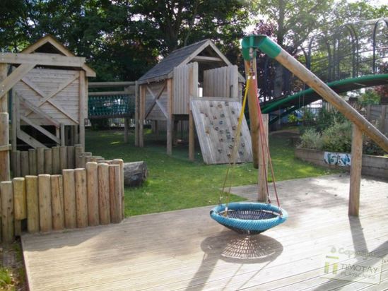 Outdoor play area by Timotay Playscapes