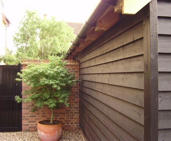 q-clad® pre-painted, black feather edge timber cladding