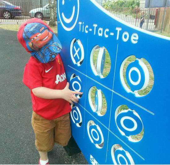 Child playing tic tac toe