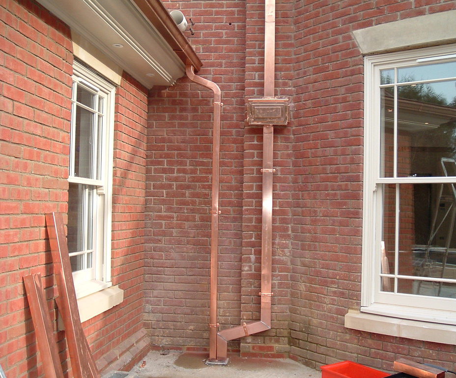 Copper ogee gutter and square downpipe domestic house Metal Gutta