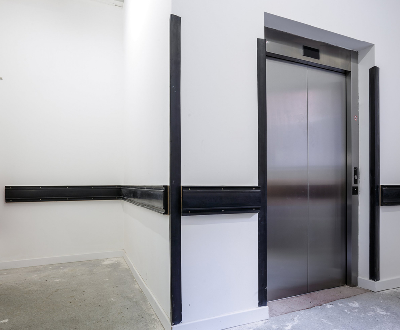 Service corridor wall protection for shopping centre Construction