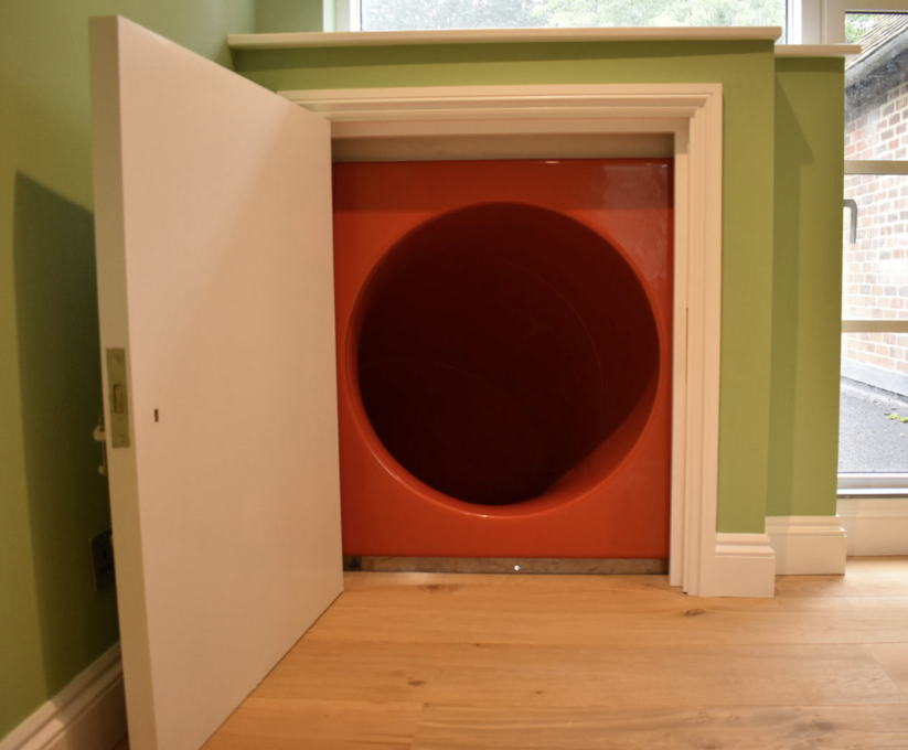 Bespoke indoor tube slide installed in family home eibe Play Ltd