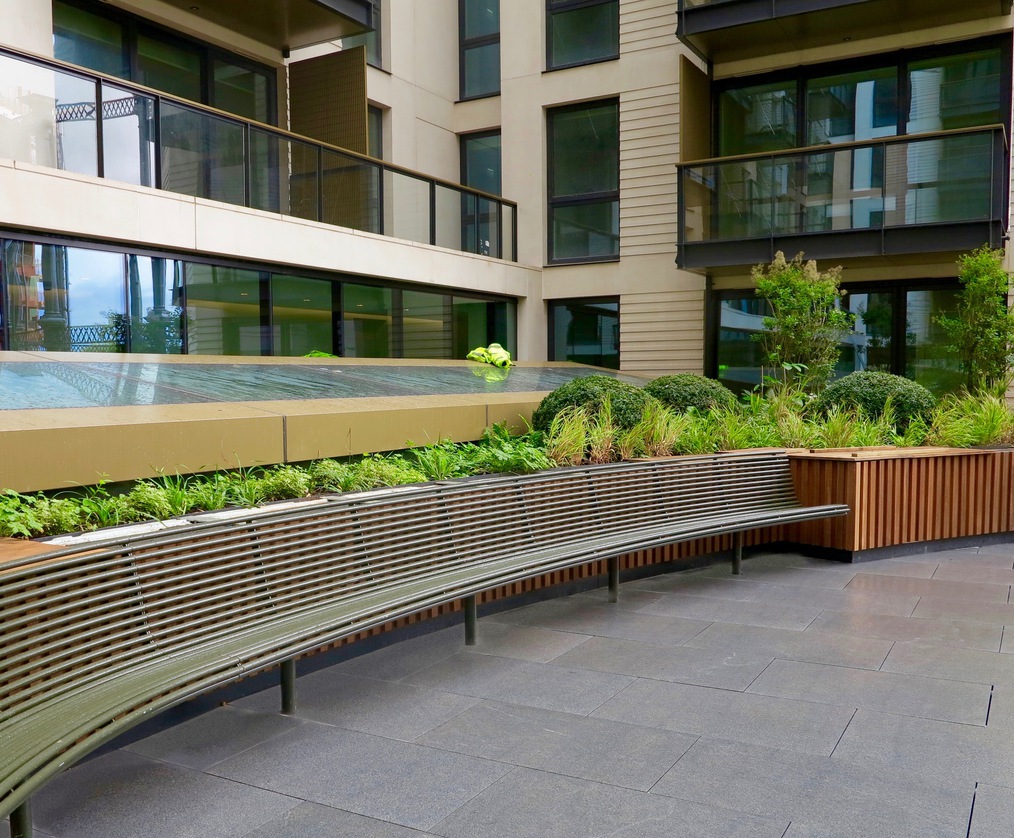 Curved seating matches planters, Kings Cross roof garden Benchmark