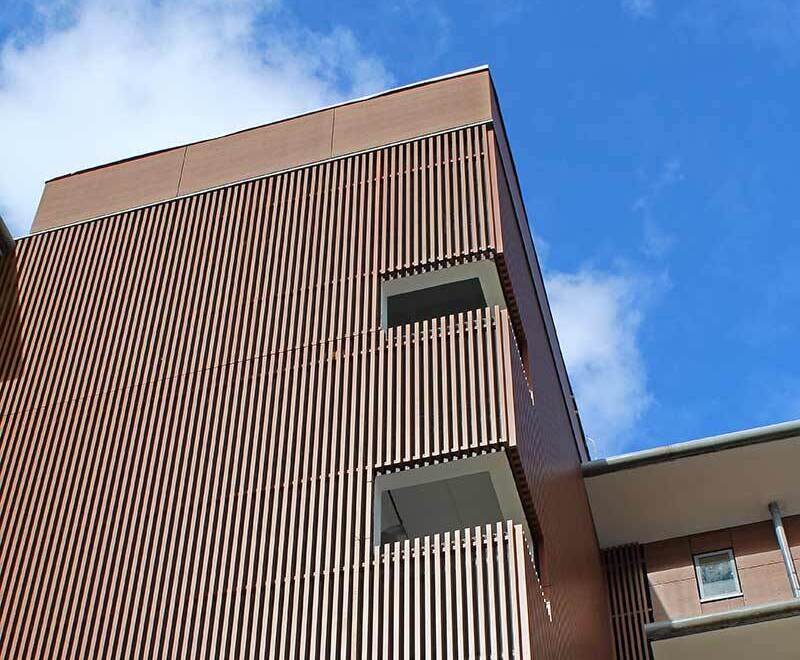 Timber cladding replaced by woodeffect aluminium system Vulcan