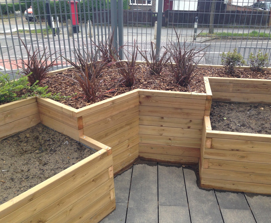 Bespoke wooden fruit and veg planters for SEN school Taylor Made