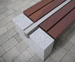 Omos s83 cut granite, stainless steel and timber bench
