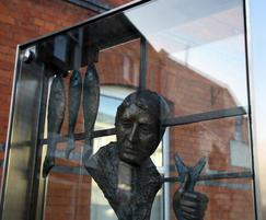 Ann Meldon Hugh sculpture in display case, Newbridge