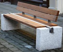 Timber seat with bush-hammered stone ends