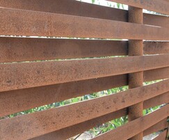Close-up of woven steel fencing