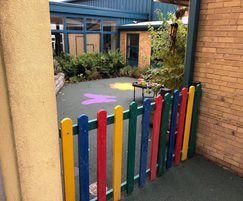 Play area with recycled plastic multicoloured fencing