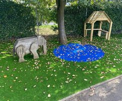 Artificial grass with watering hole