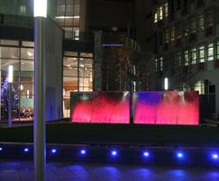 Stainless steel water feature at night