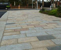 Buff, red, black and silver grey mixed granite setts