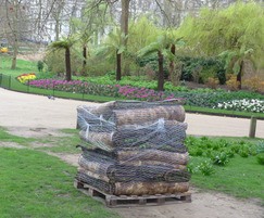 Pallets placed where Meadowmat is to replace worn lawns