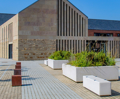 Corten bollards with concrete benches and planters