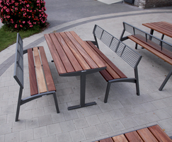 Vera Solo park table shown with benches with backrests