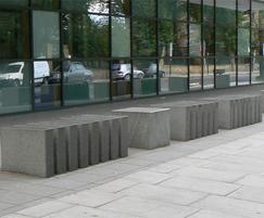 Green granite bollards with polished top surfaces