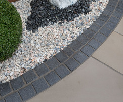 Cropped Black Sett used to edge a paving area